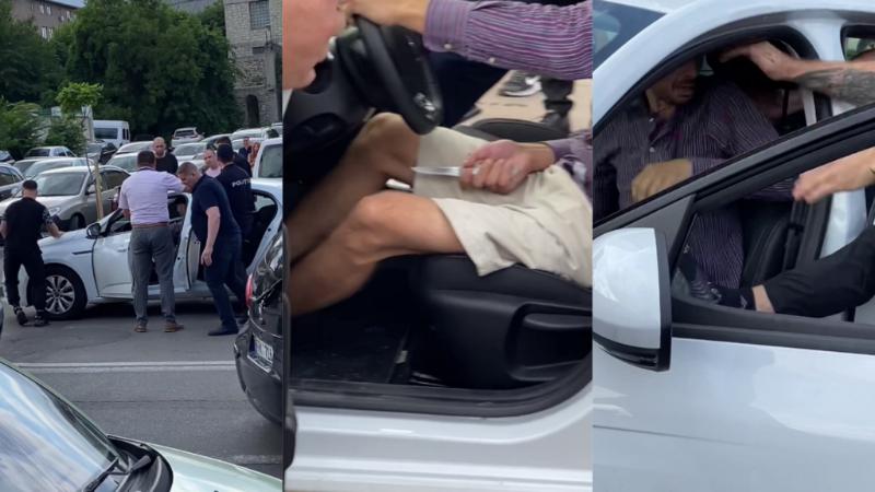  (video) Spectacol în plin trafic în capitală: Un șofer, dat jos din propria mașină de un tânăr agresiv. Mai mulți bărbați au intervenit